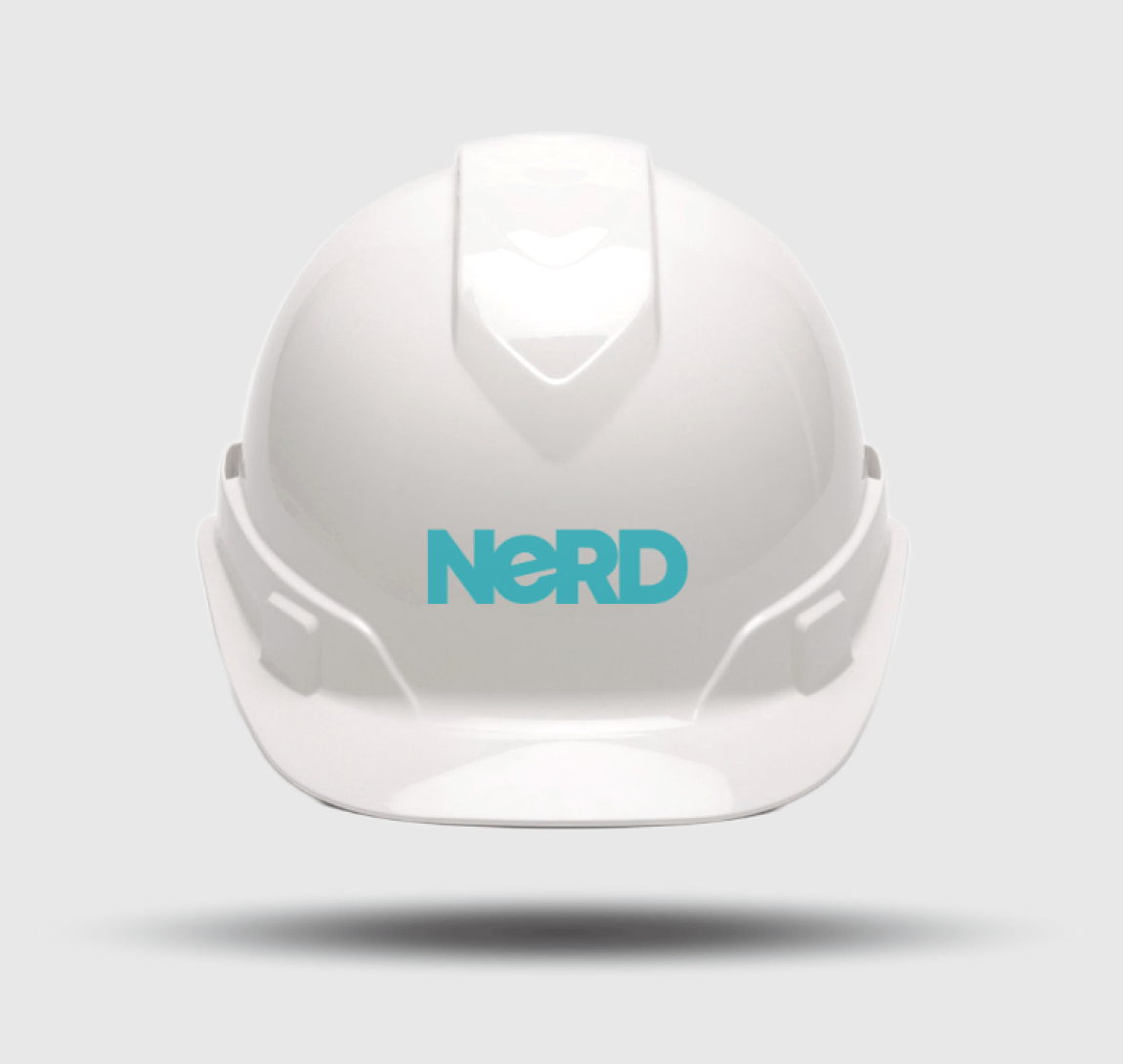A white hard hat with the word 'nerd' on it.
