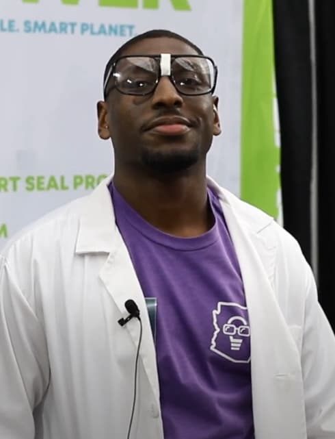 A man in a lab coat wearing goofy glasses.